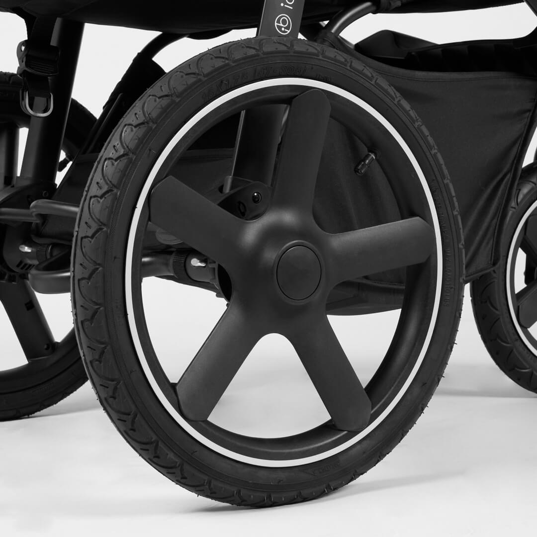Close-up shot of wheels with reflective trims in Ickle Bubba Venus Max Jogger Stroller in Space Grey colour