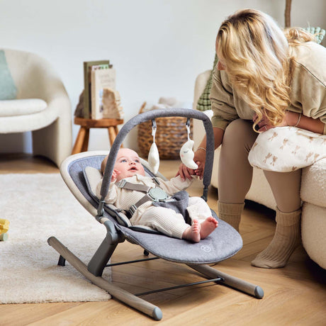 Mom with baby enjoying the Ickle Bubba Stella Rocker