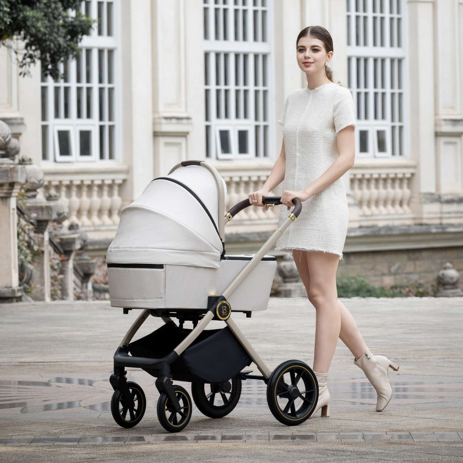 Babymore Kai with Carrycot attached in Sandstone colour