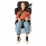 Girl sitting in Be Cool Foldy i-Size Car Seat in Carbon colour