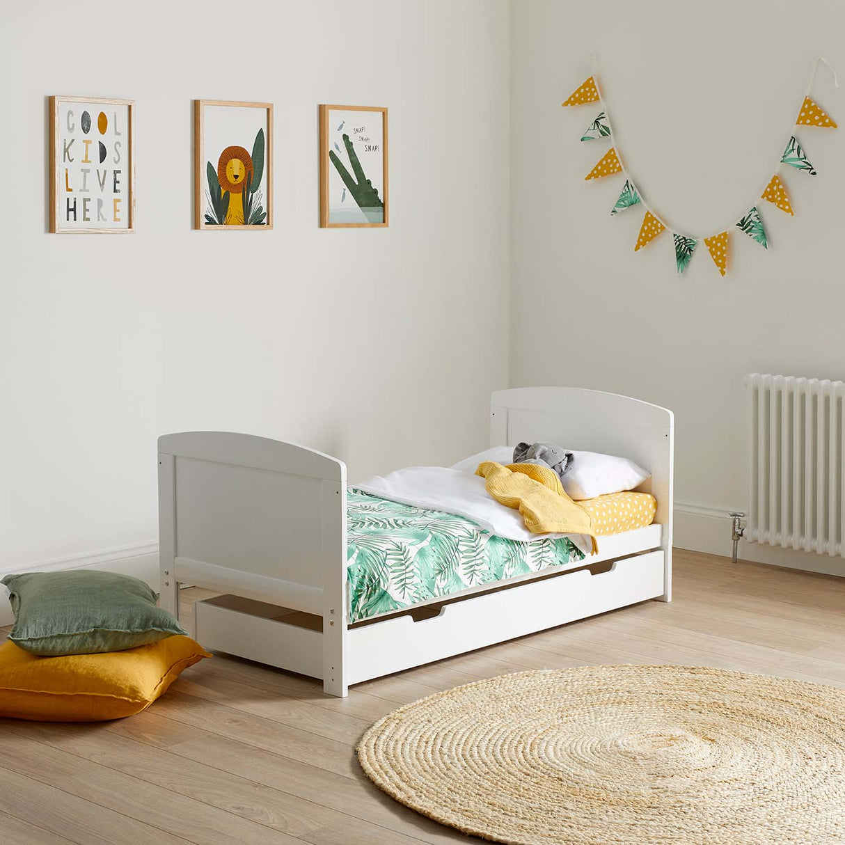 zoo-themed nursery room with an Ickle Bubba Coleby Classic Cot Bed with Under Drawer converted into toddler bed