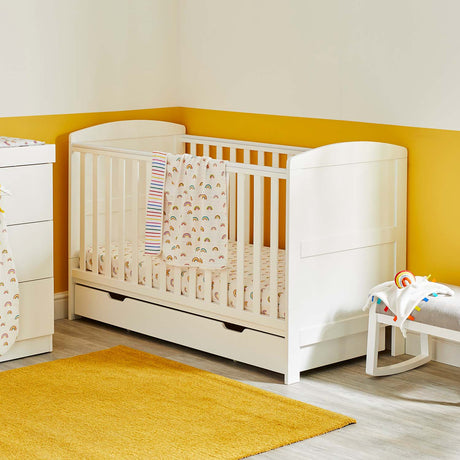 Ickle Bubba Coleby Classic Cot Bed with Under Drawer in a corner of yellow nursery room