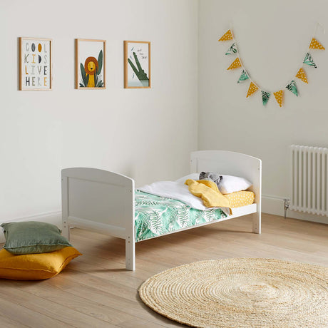 zoo-themed nursery room with an Ickle Bubba Coleby Classic Cot Bed converted into toddler bed