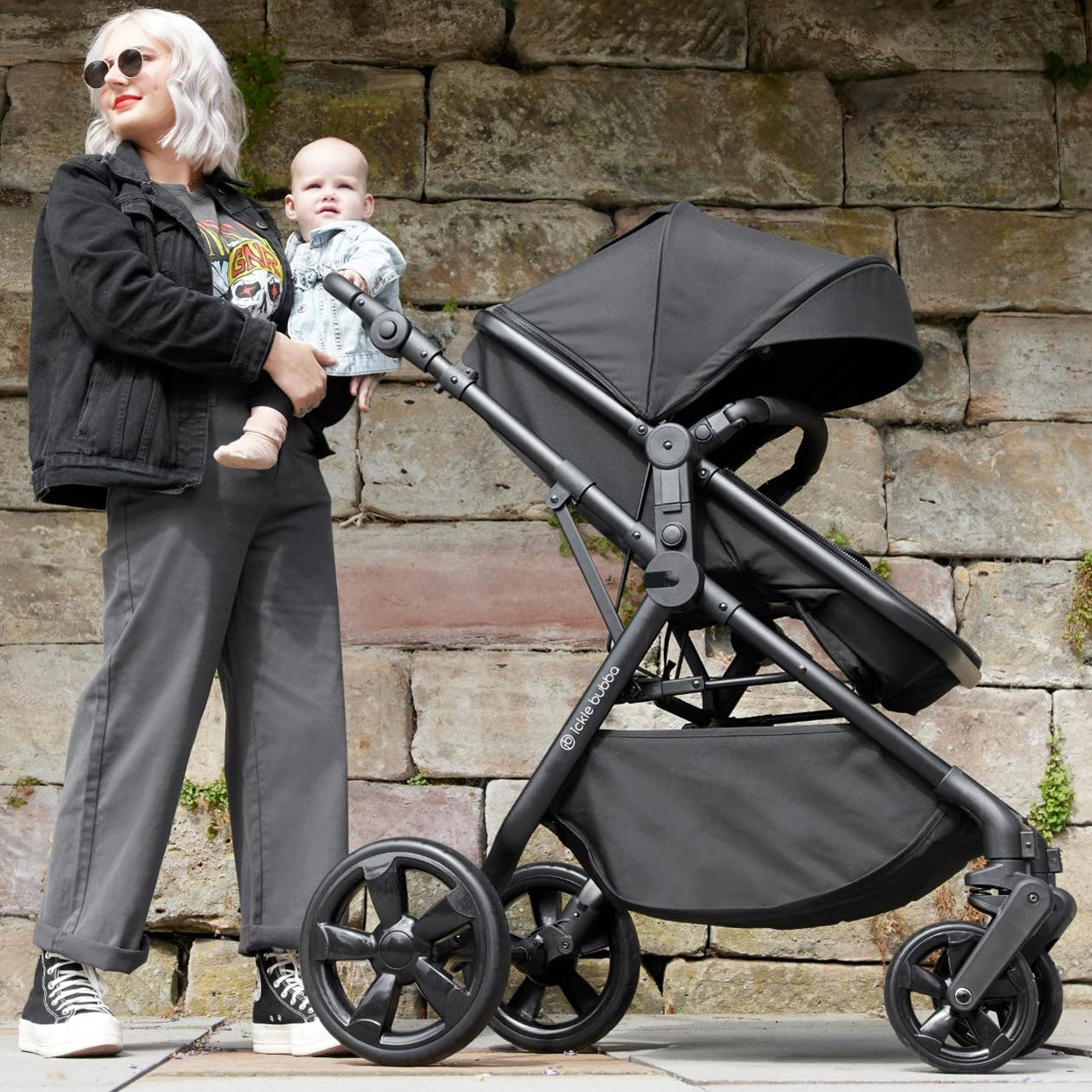 Mother and baby with Ickle Bubba Comet 3-in-1 Travel System with Astral Car Seat in Black color