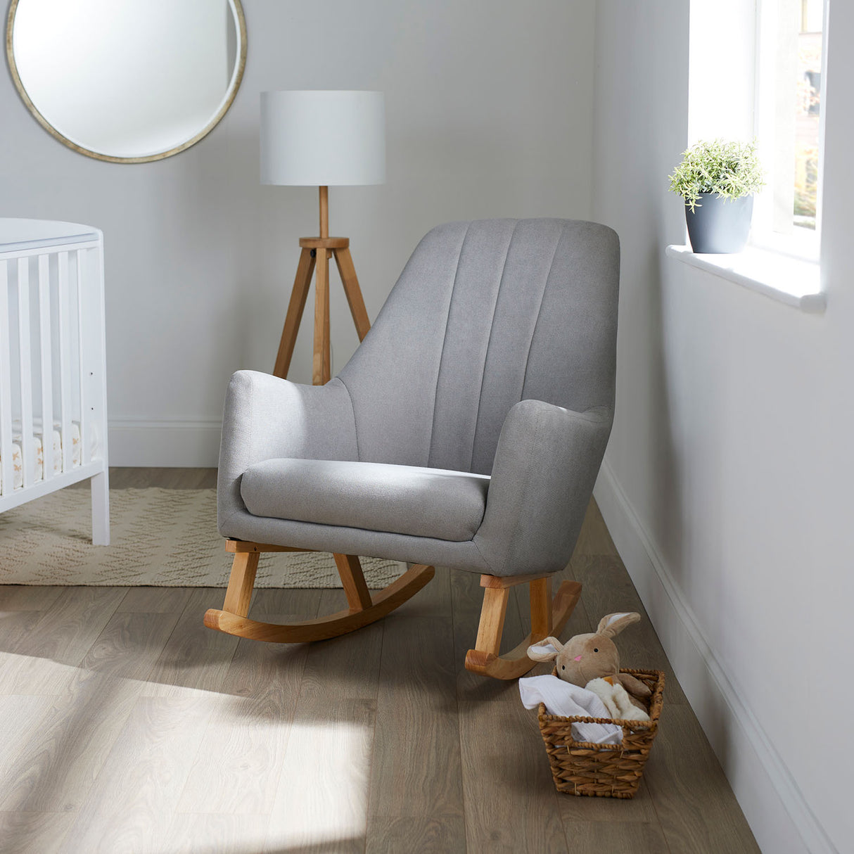 Ickle Bubba Eden Deluxe Nursery Chair in Pear Grey placed in a nursery room beside a window