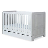 Angled shot of Ickle Bubba Pembrey 2-in-1 Cot Bed with Under Drawer in Ash Grey and White colour with Fibre Cot Mattress against a white background