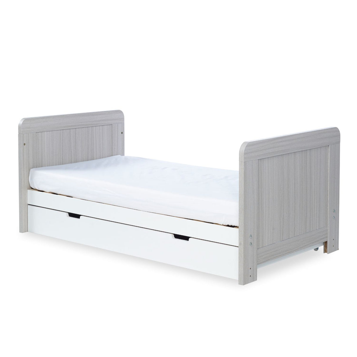 Angled shot of Ickle Bubba Pembrey 2-in-1 Cot Bed with Under Drawer in Ash Grey and White colour with Fibre Cot Mattress converted into a toddler bed against a white background