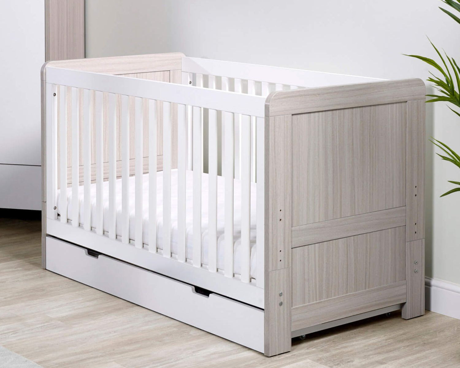 angled shot of Ickle Bubba Pembrey 2-in-1 Cot Bed in Ash Grey with White colour