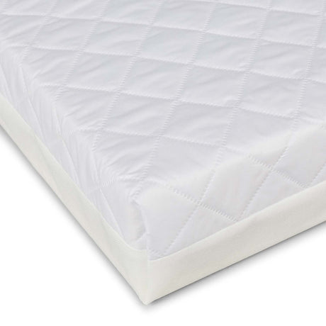 corner of Ickle Bubba Premium Sprung Cot Mattress in white colour - washable and breathable