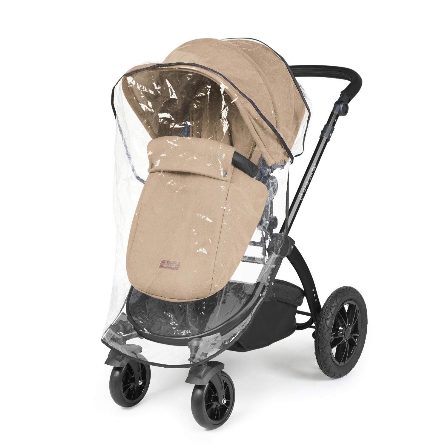 Rain cover placed on an Ickle Bubba Stomp Luxe Pushchair in Desert beige colour