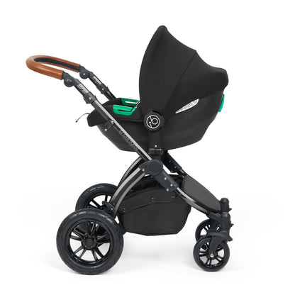 Ickle Bubba Stomp Luxe Pushchair with Cirrus i-Size car seat attached in Midnight black colour with tan handle