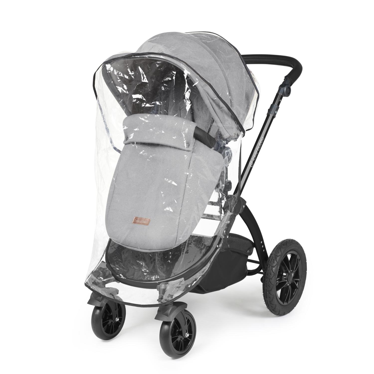 Rain cover placed on an Ickle Bubba Stomp Luxe Pushchair in Pearl Grey colour