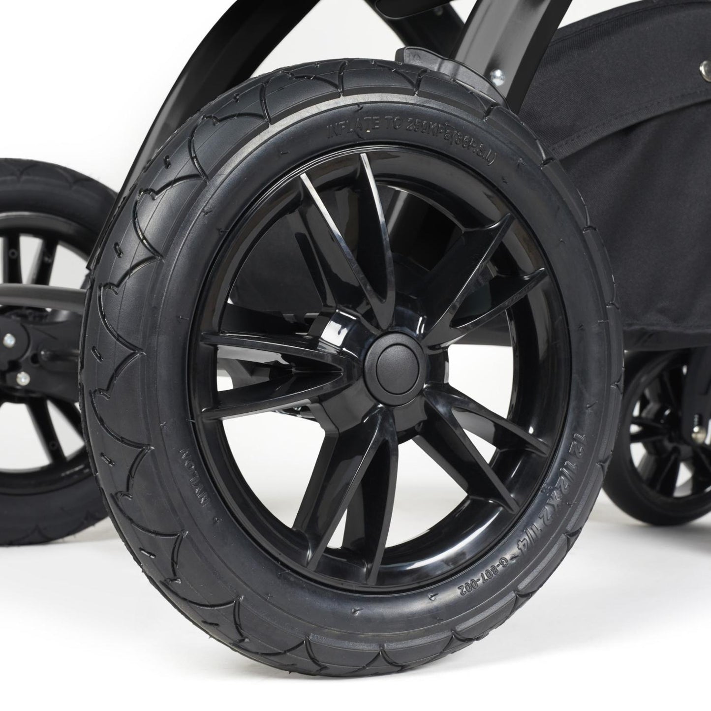 Close-up shot of all-terrain wheels in Ickle Bubba Stomp Luxe Pushchair in Pearl Grey colour