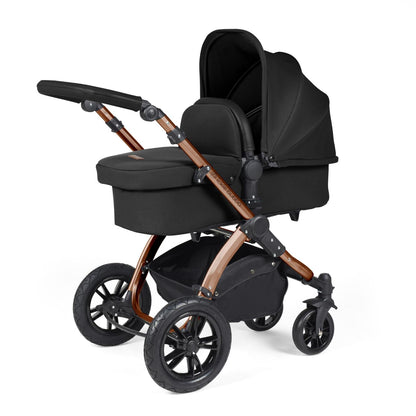 Ickle Bubba Stomp Luxe Pushchair with carrycot attached in Midnight black colour with bronze chassis