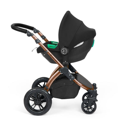 Ickle Bubba Stomp Luxe Pushchair with Cirrus i-Size car seat attached in Midnight black colour with bronze chassis
