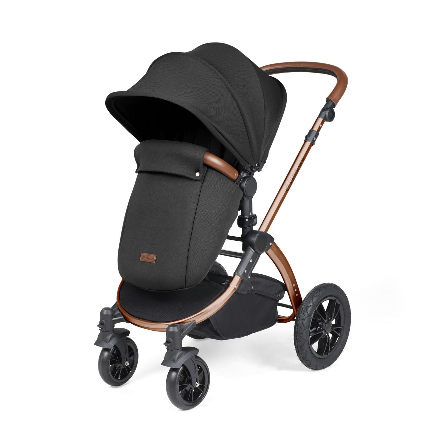 Ickle Bubba Stomp Luxe Pushchair with foot warmer attached in Midnight black colour with bronze chassis and tan handle