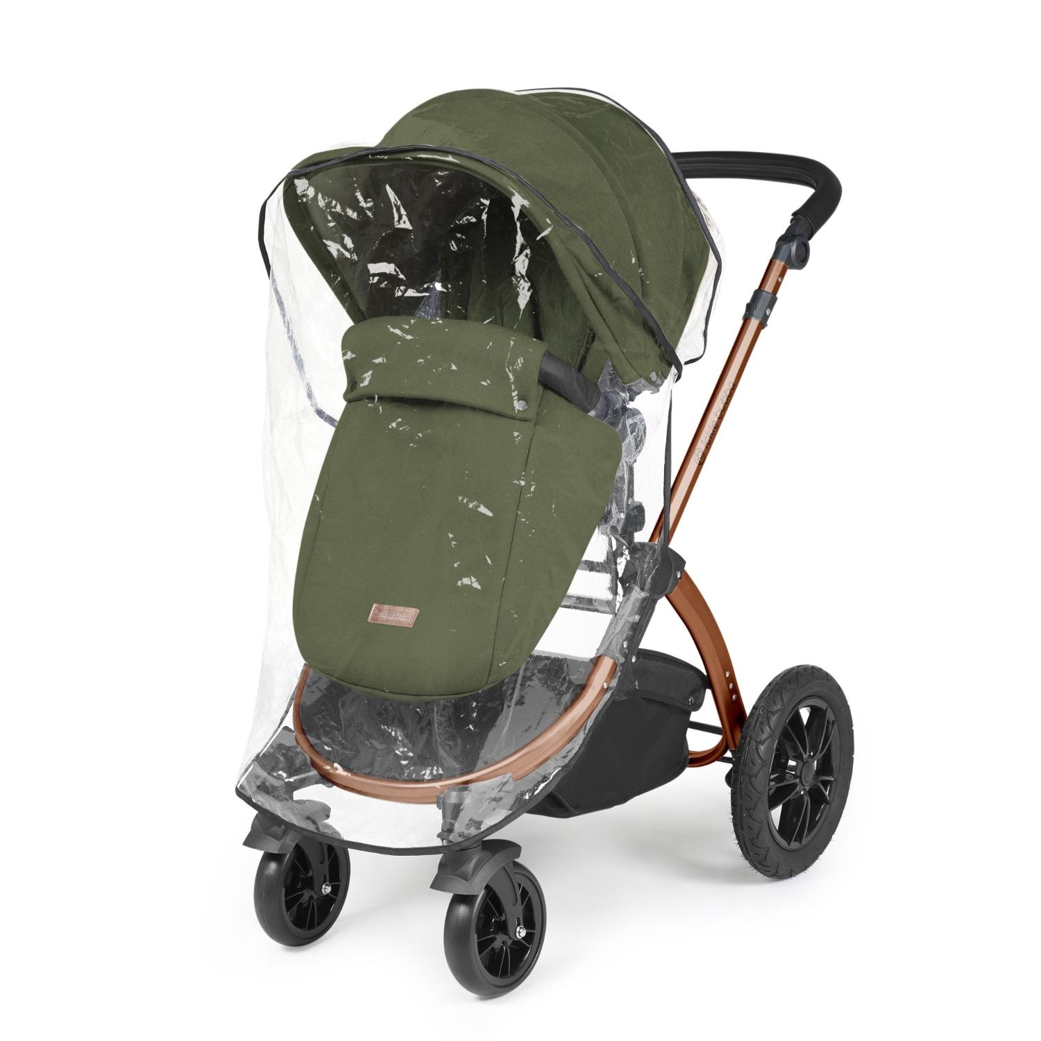 Rain cover placed on an Ickle Bubba Stomp Luxe Pushchair in Woodland green colour with bronze chassis
