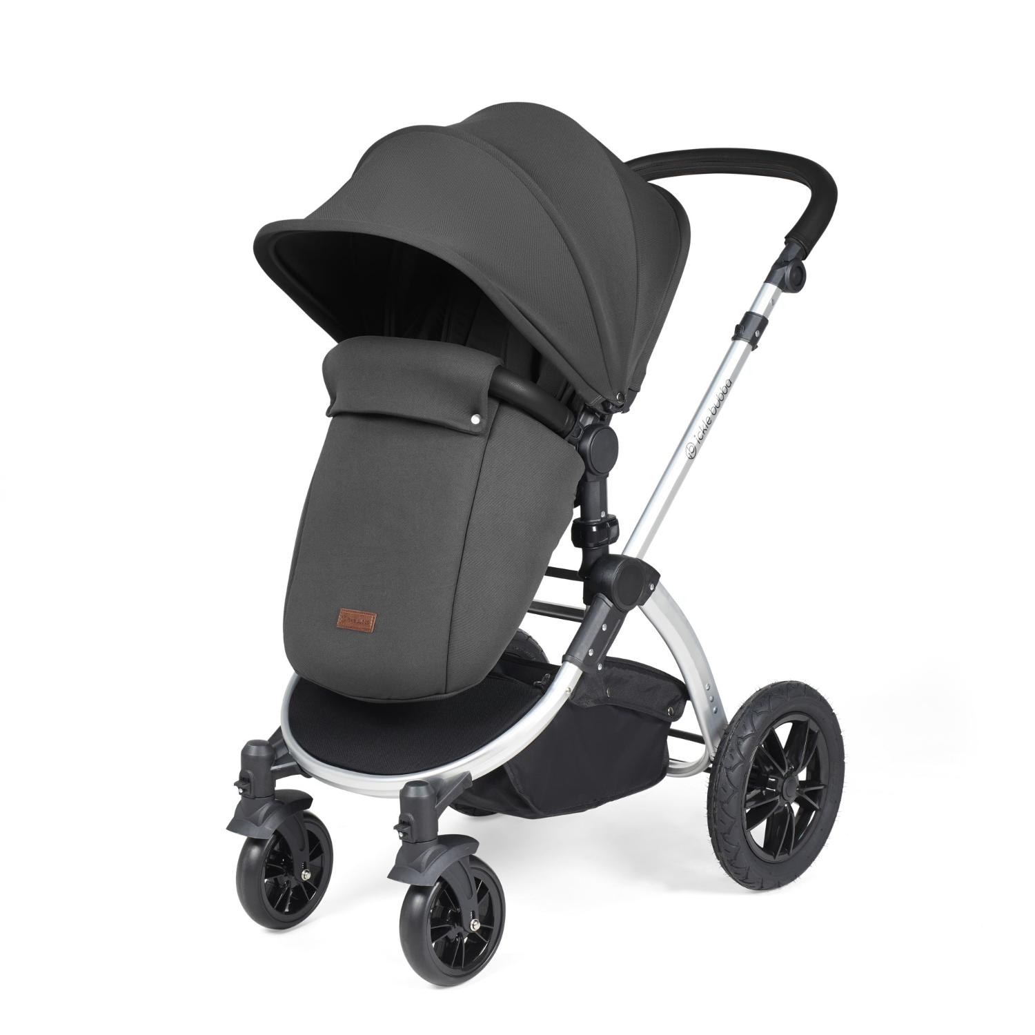 Ickle Bubba Stomp Luxe Pushchair with foot warmer attached in Charcoal Grey colour with silver chassis
