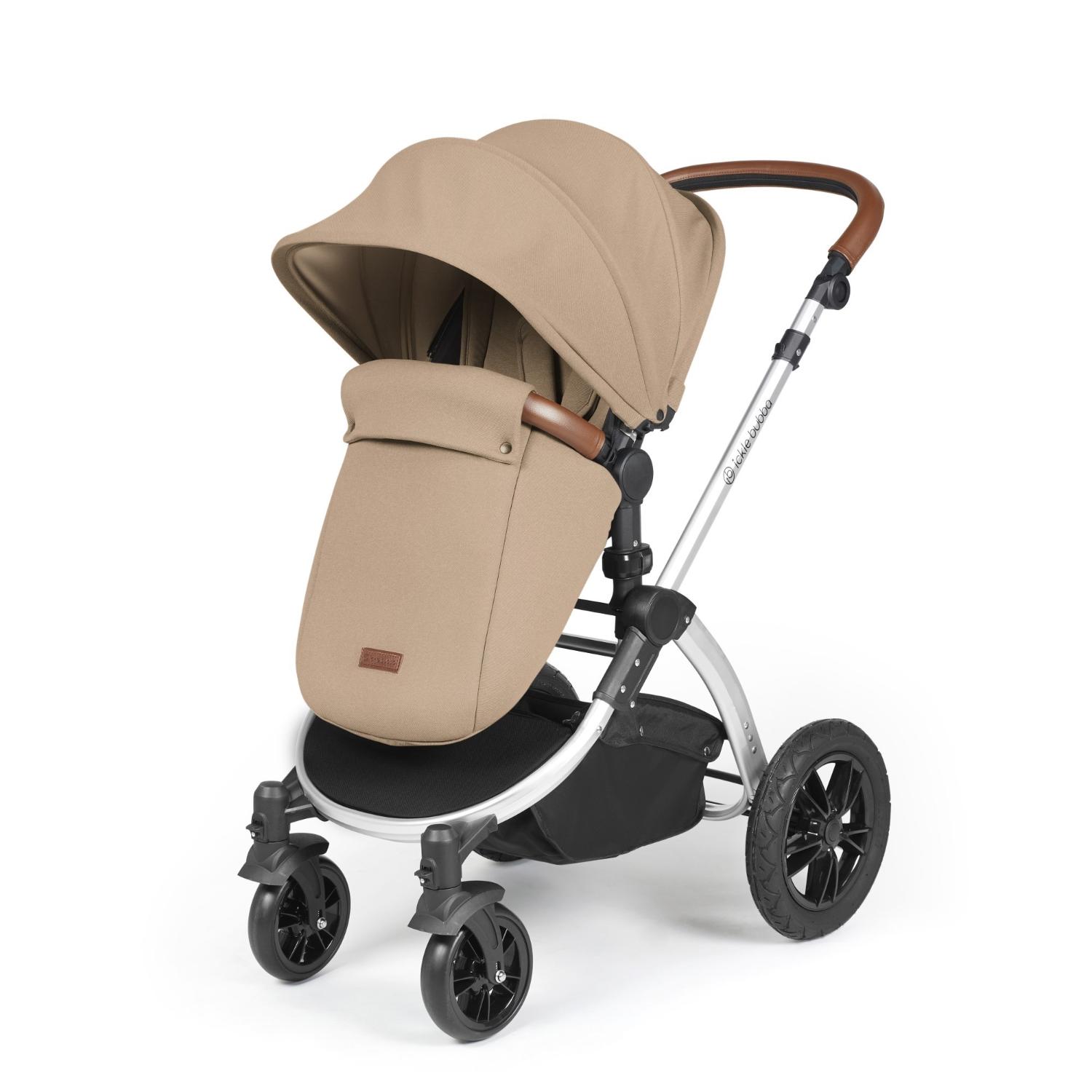 Ickle Bubba Stomp Luxe Pushchair with foot warmer attached in Desert beige colour with silver chassis and tan handle
