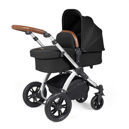 Ickle Bubba Stomp Luxe Pushchair with carrycot attached in Midnight black colour with silver chassis and tan handle