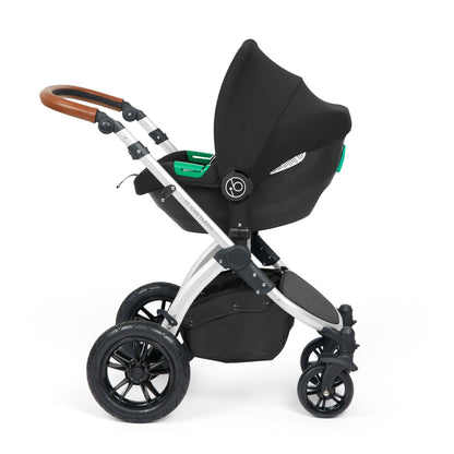 Ickle Bubba Stomp Luxe Pushchair with Cirrus i-Size car seat attached in Midnight black colour with silver chassis and tan handle