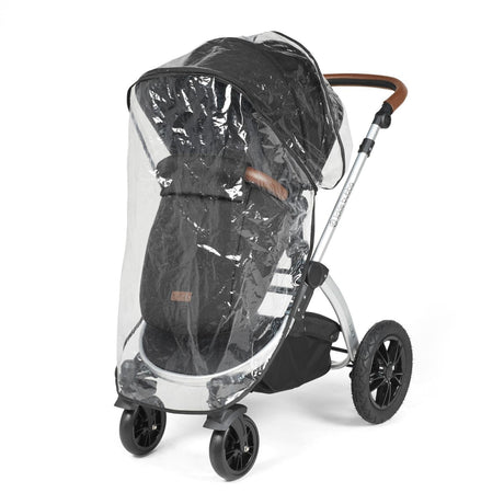 Rain cover placed on an Ickle Bubba Stomp Luxe Pushchair in Midnight black colour with silver chassis and tan handle