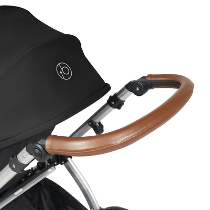 Handlebar detail of Ickle Bubba Stomp Luxe Pushchair in Midnight black colour with silver chassis and tan handle