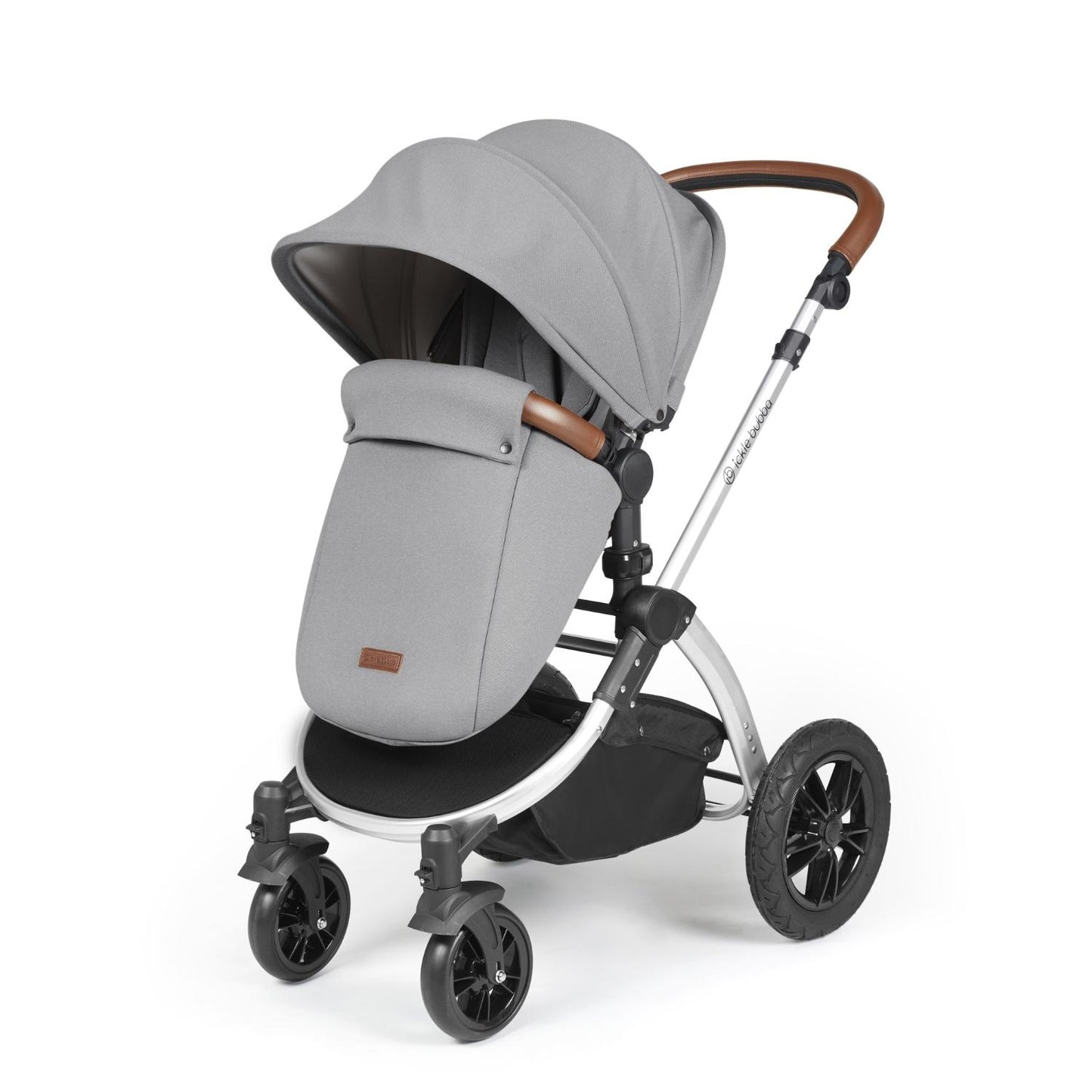 Ickle Bubba Stomp Luxe Pushchair with foot warmer attached in Pearl Grey colour with silver chassis and tan handle