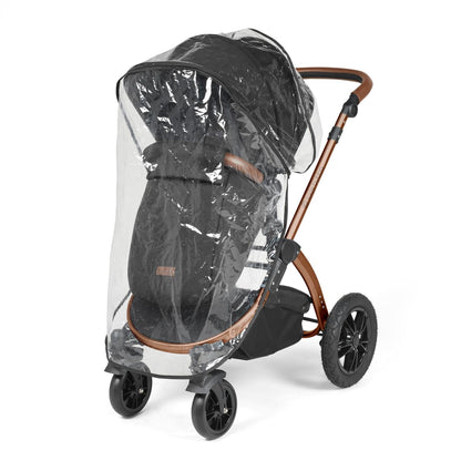 Rain cover placed on an Ickle Bubba Stomp Luxe Pushchair in Midnight black colour with bronze chassis and tan handle