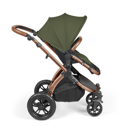 Side view of Ickle Bubba Stomp Luxe Pushchair with seat unit attached in Woodland green colour with bronze chassis and tan handle