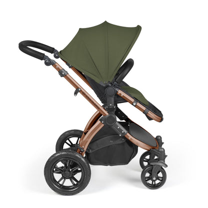 Side view of Ickle Bubba Stomp Luxe Pushchair with seat unit attached in Woodland green colour with bronze chassis