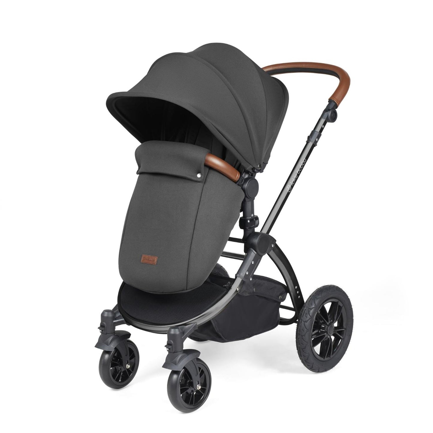 Ickle Bubba Stomp Luxe Pushchair with foot warmer attached in Charcoal Grey colour with tan handle