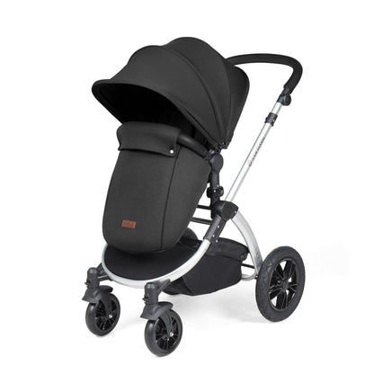 Ickle Bubba Stomp Luxe Pushchair with foot warmer attached in Midnight black colour with silver chassis