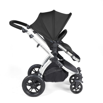 Side view of Ickle Bubba Stomp Luxe Pushchair with seat unit attached in Midnight black colour with silver chassis