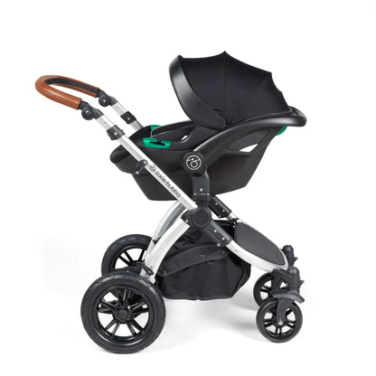 Ickle Bubba Stomp Luxe Pushchair with Stratus i-Size car seat attached in Midnight black colour with silver chassis and tan handle