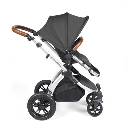 Side view of Ickle Bubba Stomp Luxe Pushchair with seat unit attached in Charcoal Grey colour with silver chassis and tan handle