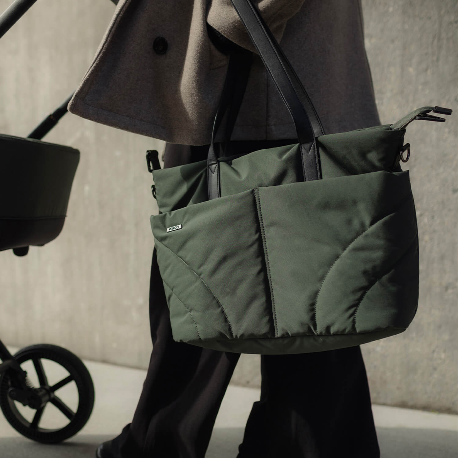Person carrying the Venicci Claro bag in Forest green colour