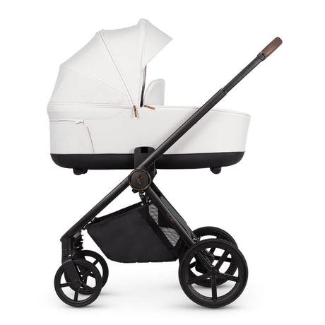 Venicci Claro carrycot in Vanilla colour placed in the Claro frame