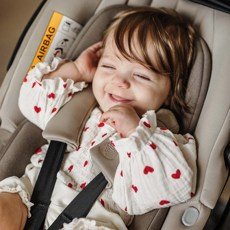 Smiling baby in Venicci Tiago i-Size Car Seat