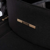 Close-up shot of logo in Venicci Upline Pram in All Black colour