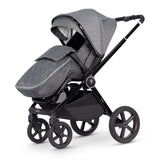 Venicci Upline 2-in-1 Pram in Slate Grey colour with seat unit and footmuff attached in forward-facing position